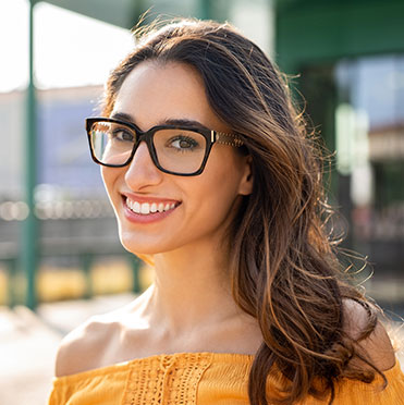 Woman wearing eyeglasses and smiling